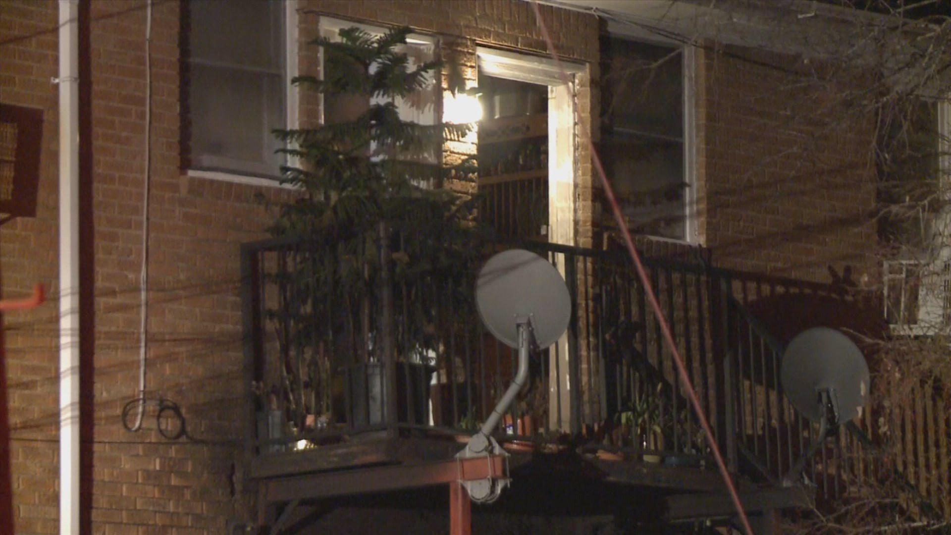 Neighbors throw bricks through window as fire roars