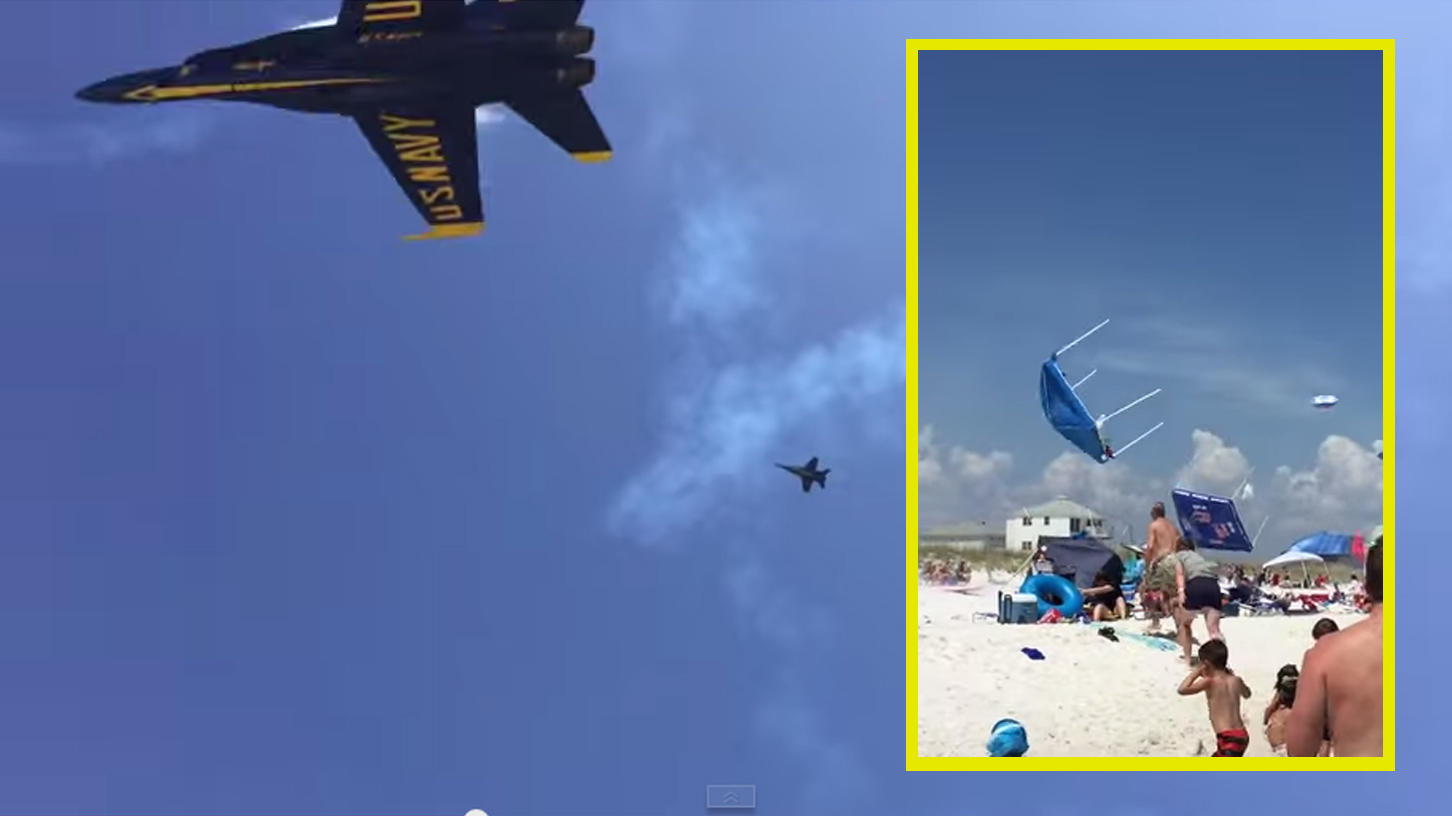 Blue Angel flyby sends beach umbrellas flying