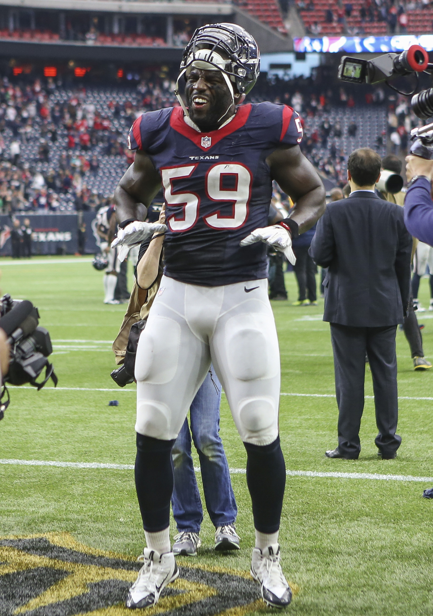 Whitney Merciless of the Houston Texans strips the ball away from