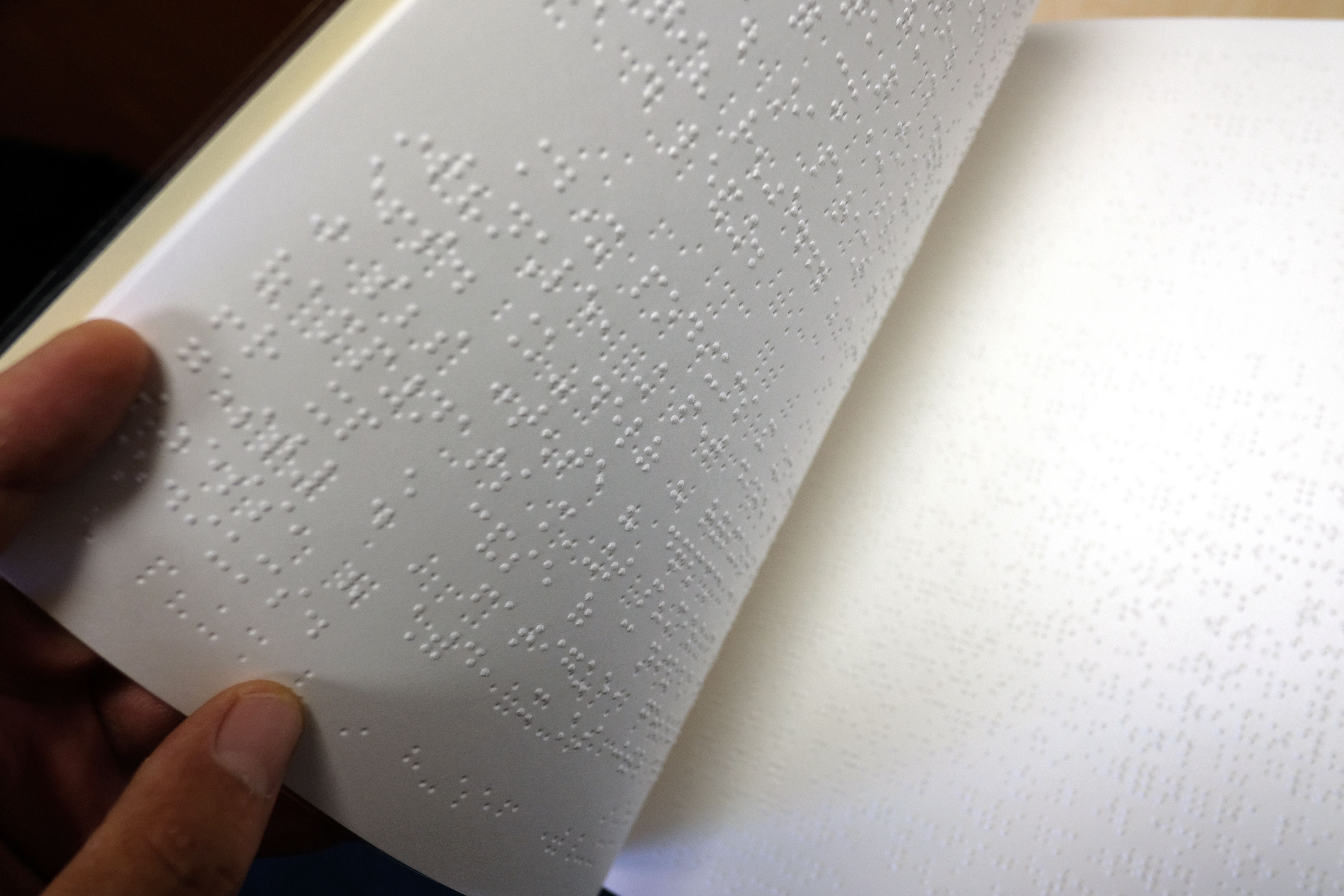 High School yearbook staff surprises blind student with braille