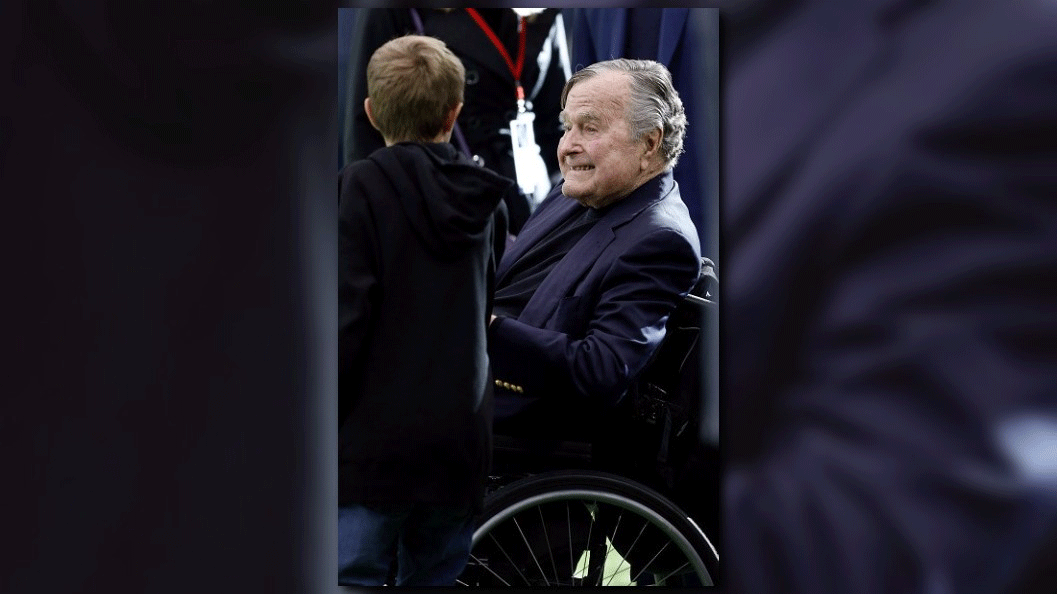 H.W. Bush breathing on his own, still in ICU
