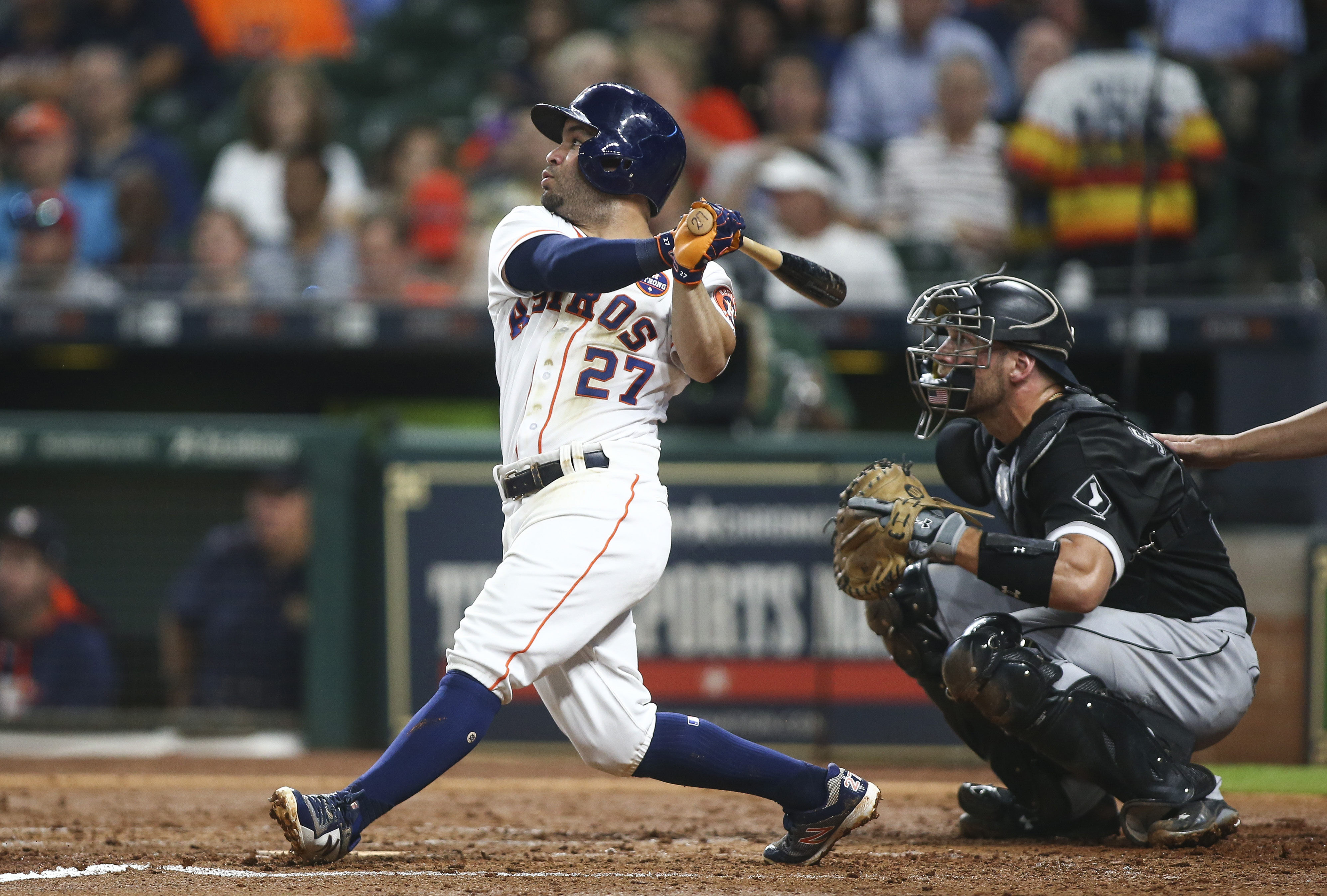 Houston Astros' Marwin Gonzalez watches his solo home run off of